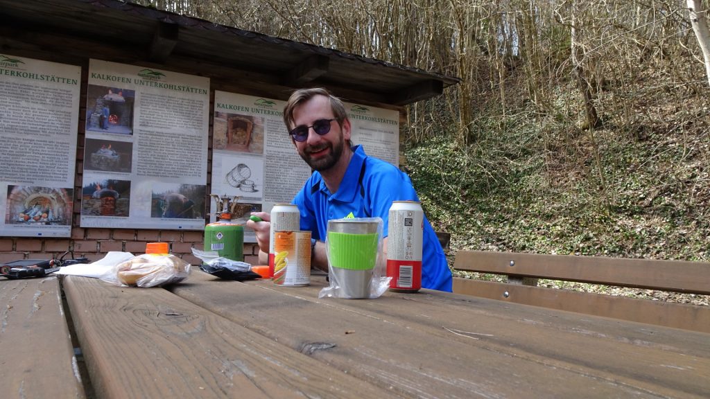 Stefan enjoys a warm meal and a cold beer at the rest area