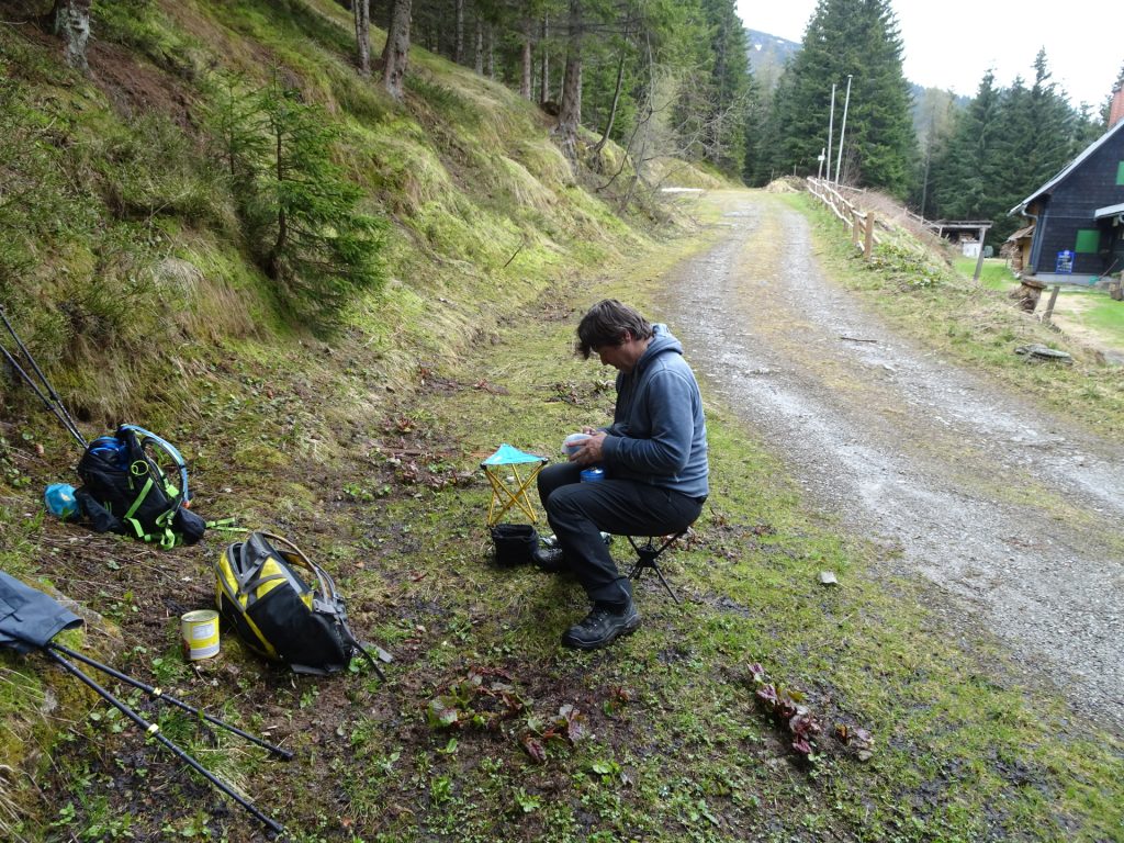 Robert prepares a warm meal at "Karl-Lechner" hut